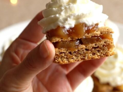 A close-up of no-bake apple pie graham bites on a plate, featuring crispy graham squares topped with apple filling