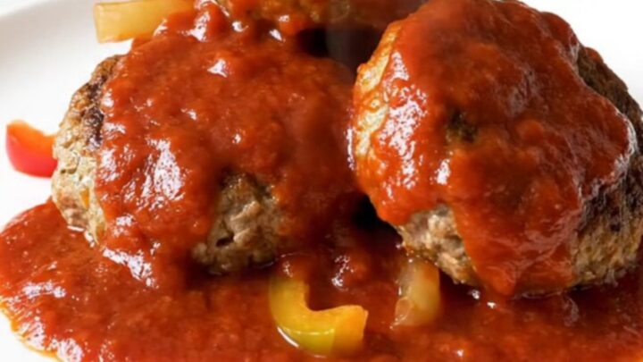 Four golden-brown turkey patties arranged in a ring inside a black slow cooker
