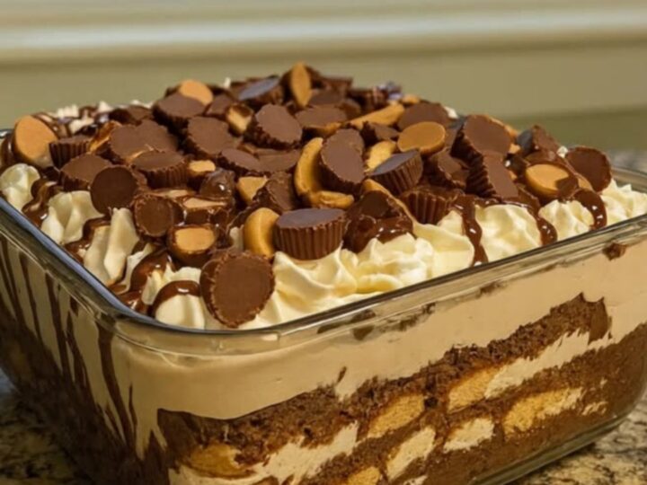 A beautiful peanut butter chocolate trifle in a glass bowl with visible layers.