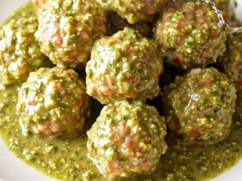 A high-angle view of succulent turkey meatballs simmering in a rich