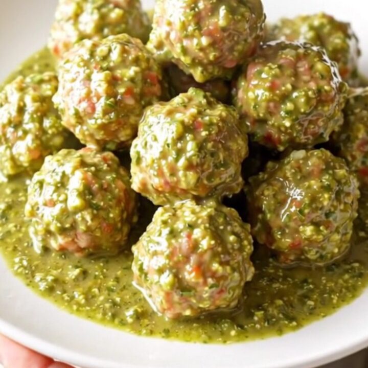 A high-angle view of succulent turkey meatballs simmering in a rich