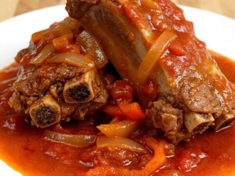 A top-down view of tender boneless country-style pork ribs in a slow cooker