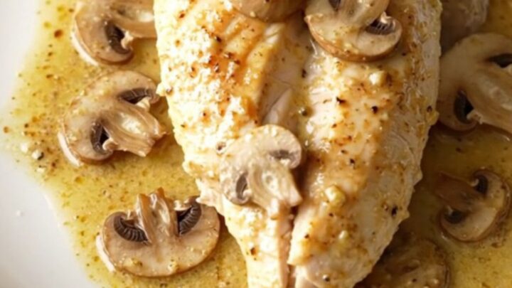 A warm, creamy dish of slow-cooked chicken breasts smothered in a rich mushroom and Dijon sauce.