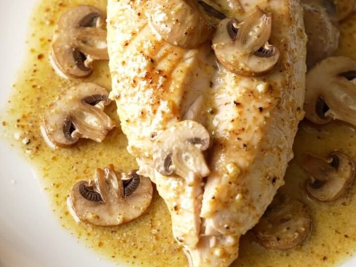A warm, creamy dish of slow-cooked chicken breasts smothered in a rich mushroom and Dijon sauce.
