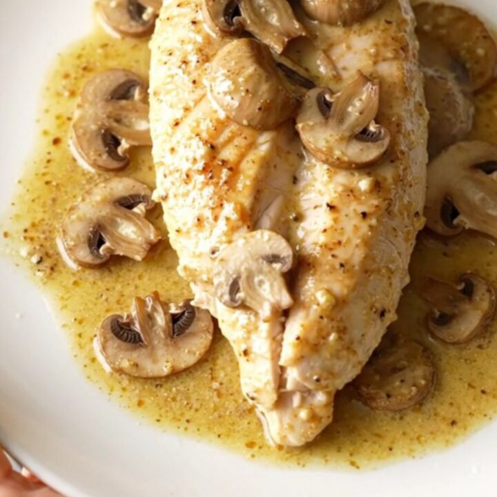 A warm, creamy dish of slow-cooked chicken breasts smothered in a rich mushroom and Dijon sauce.