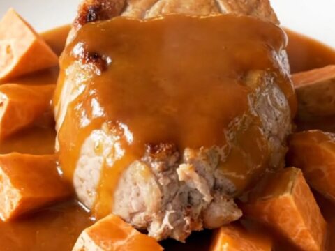 A top-down view of slow cooker maple sriracha pork tenderloin with sweet potatoes.