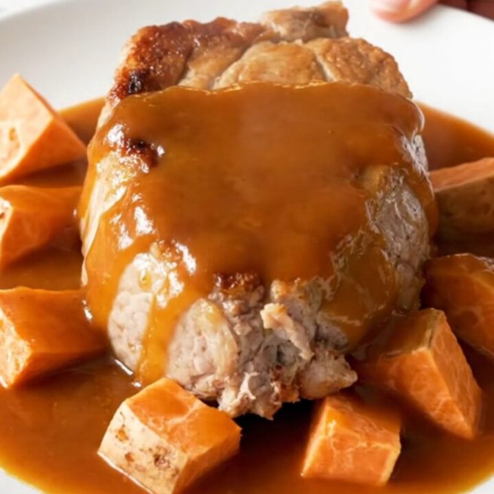 A top-down view of slow cooker maple sriracha pork tenderloin with sweet potatoes.