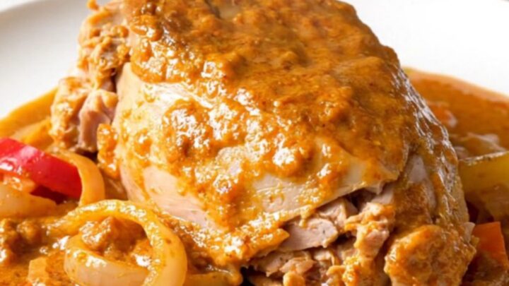 A bowl of creamy turkey paprikash with vibrant red peppers and onions in a rich, paprika-infused sauce.