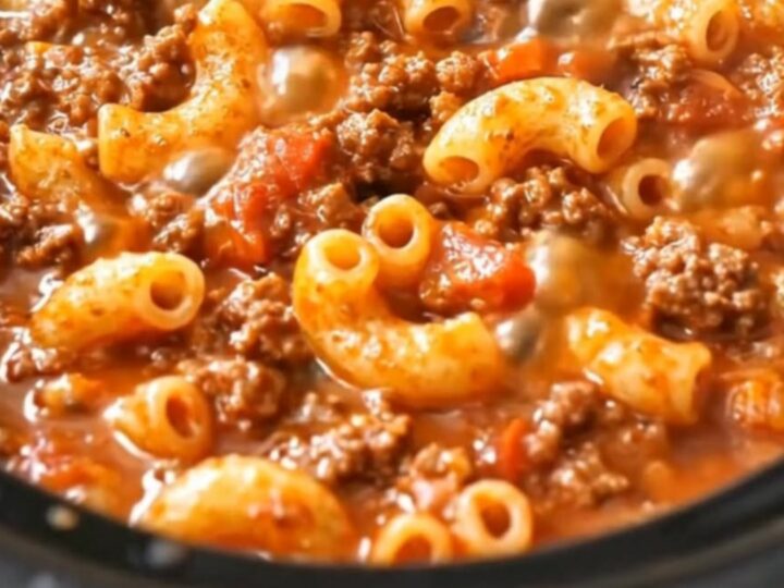 A piping-hot, saucy beef and elbow macaroni skillet glistening under warm light.