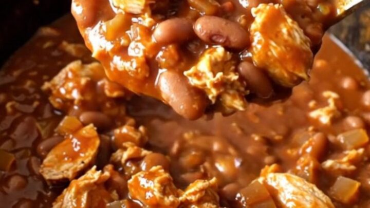 A close-up view of a serving of smoky barbecue turkey chili in a bowl, showcasing the rich
