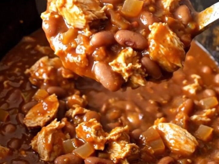 A close-up view of a serving of smoky barbecue turkey chili in a bowl, showcasing the rich