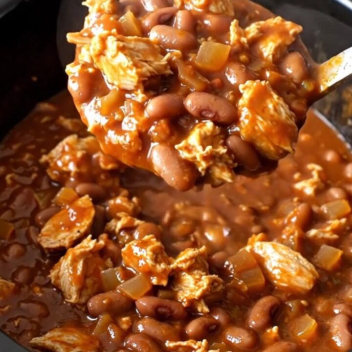 A close-up view of a serving of smoky barbecue turkey chili in a bowl, showcasing the rich