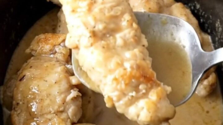 Slow cooker Swedish gravy chicken tenders and potatoes in a black stoneware insert