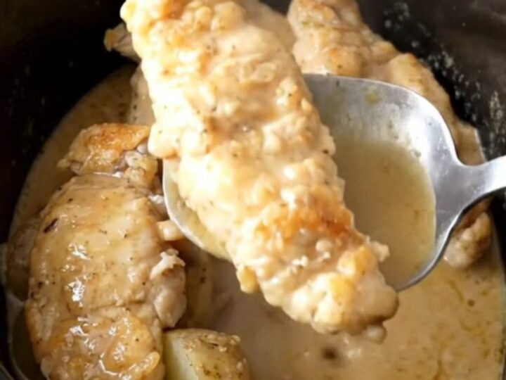 Slow cooker Swedish gravy chicken tenders and potatoes in a black stoneware insert
