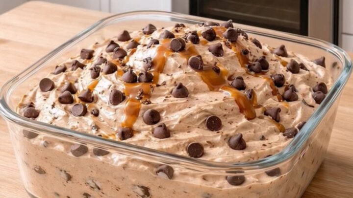 A clear square glass dish filled with airy peanut butter fluff