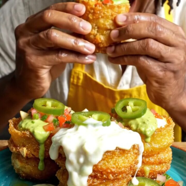 Golden crispy plantain tostones cups filled with molten white cheese and vibrant pico de gallo.