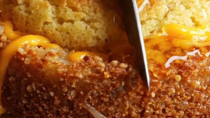 A golden-crusted skillet cornbread sliced into wedges, showing the crispy hashbrown potato bottom and cheesy center.