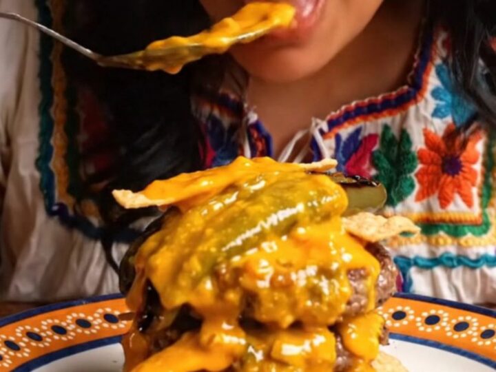 Molten chorizo queso cascading over a double smash burger with roasted poblanos.