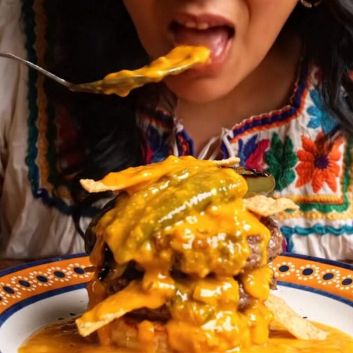 Molten chorizo queso cascading over a double smash burger with roasted poblanos.