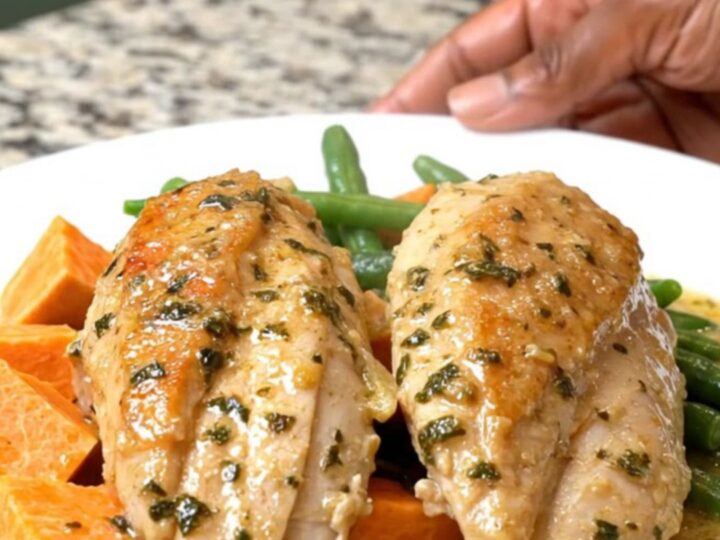 A rustic slow cooker chicken dinner with sweet potatoes and green beans in a creamy herb sauce.