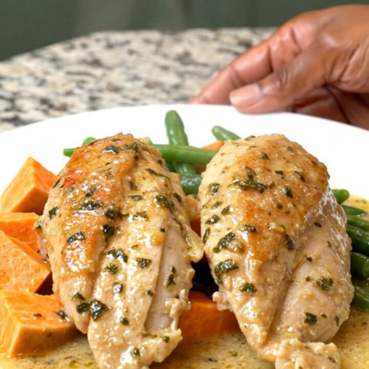 A rustic slow cooker chicken dinner with sweet potatoes and green beans in a creamy herb sauce.