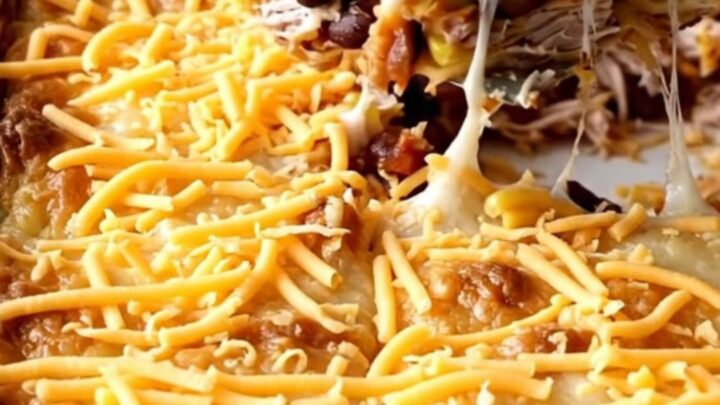A golden, bubbling ground turkey quesadilla casserole in a white rectangular baker on a beige countertop.