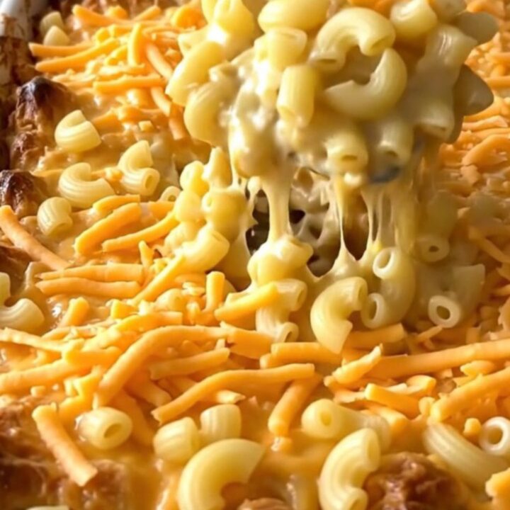 A golden, bubbling creamy cottage cheese mac and cheese bake in a rectangular ceramic dish.