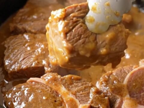 Slow cooker filled with tender beef cube steaks, pepperoncini, and a rich, buttery gravy.
