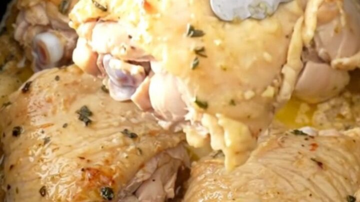 Slow cooker ranch chicken thighs with baby carrots and potatoes in a savory broth.