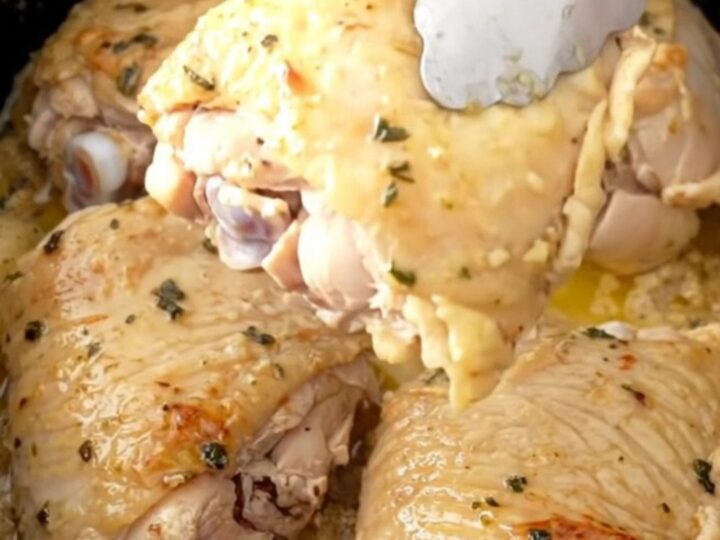 Slow cooker ranch chicken thighs with baby carrots and potatoes in a savory broth.