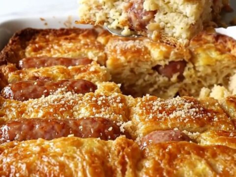 A golden-brown maple sausage French toast bake in a rectangular ceramic dish.