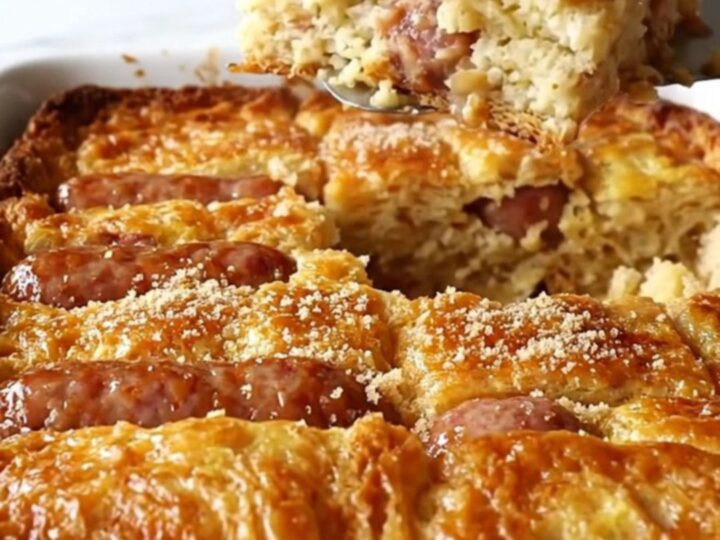 A golden-brown maple sausage French toast bake in a rectangular ceramic dish.