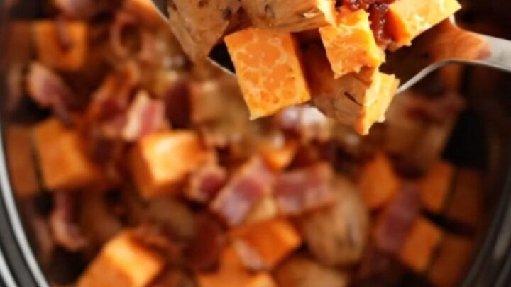 A close-up view of maple bacon sweet potatoes served in a rustic bowl, showing glossy glaze.