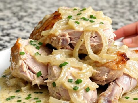 Slow cooker sour cream and onion turkey tenderloin with a thick creamy sauce and fresh chives.