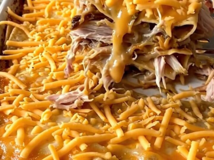 A golden, bubbling King Ranch casserole in a white rectangular dish on a granite countertop.