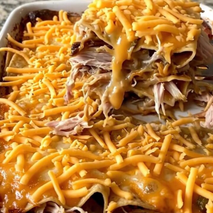A golden, bubbling King Ranch casserole in a white rectangular dish on a granite countertop.