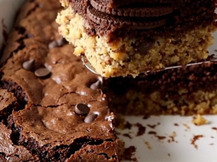 Triple layer cookie brownie bars showing distinct layers of cookie dough, sandwich cookies, and fudgy brownie.