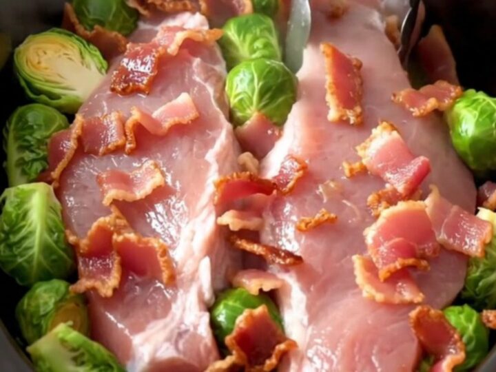 Whole pork tenderloin braised in a slow cooker with Brussels sprouts and crispy bacon crumbles in a Dijon broth.