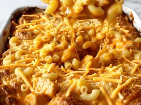 A golden, bubbling Nashville Hot Chicken Mac and Cheese bake in a white rectangular ceramic dish.