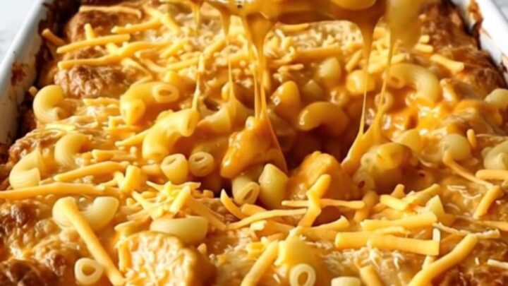 A golden, bubbling Nashville Hot Chicken Mac and Cheese bake in a white rectangular ceramic dish.