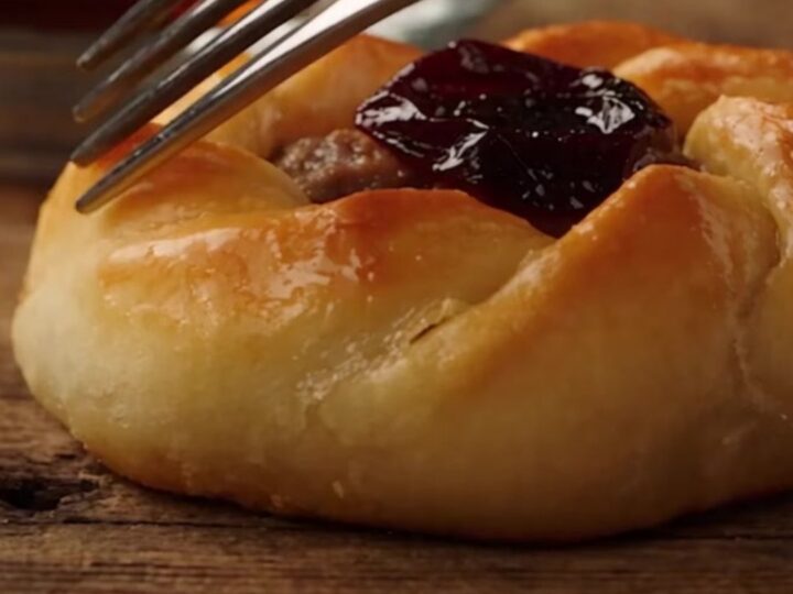 A close-up of a freshly baked Antakya Kaytaz borek showing a golden, blistered, and flaky pastry crust.
