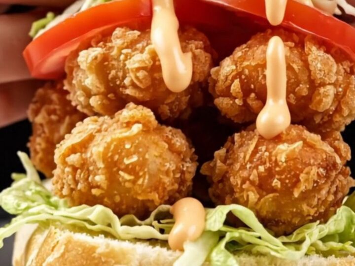A crispy New Orleans style fried oyster Po' Boy sandwich on a toasted French baguette.