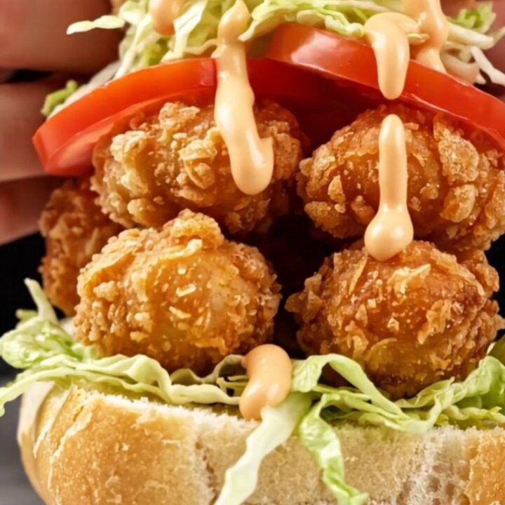A crispy New Orleans style fried oyster Po' Boy sandwich on a toasted French baguette.
