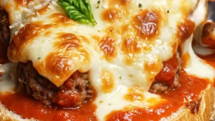 A crispy golden-brown meatball boat filled with melted cheese and marinara.