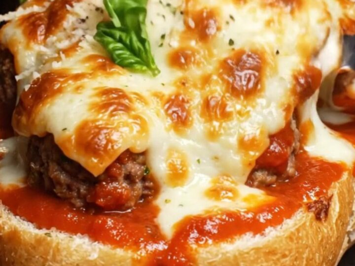 A crispy golden-brown meatball boat filled with melted cheese and marinara.