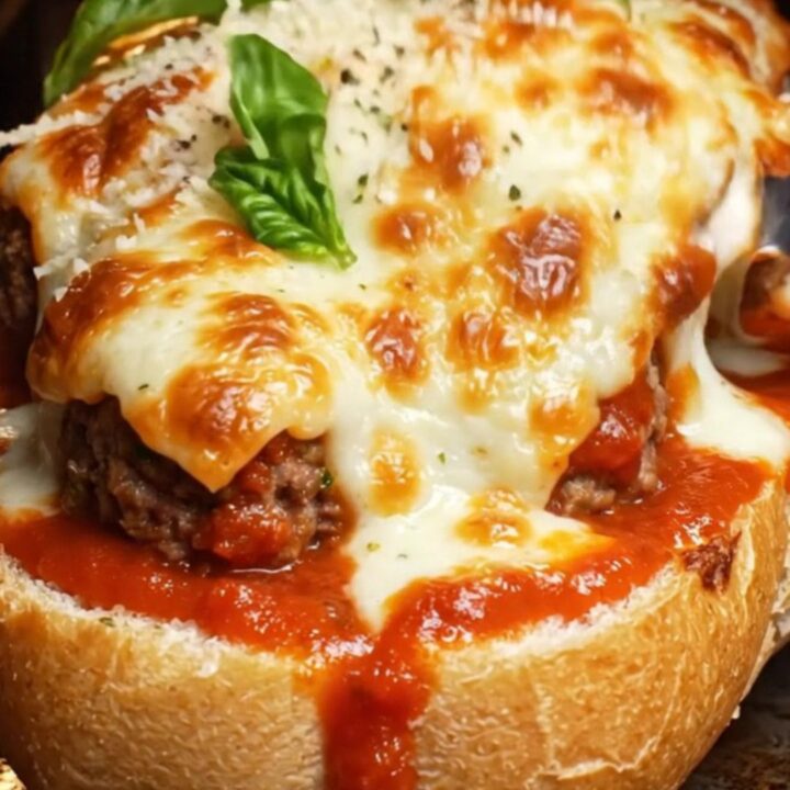 A crispy golden-brown meatball boat filled with melted cheese and marinara.