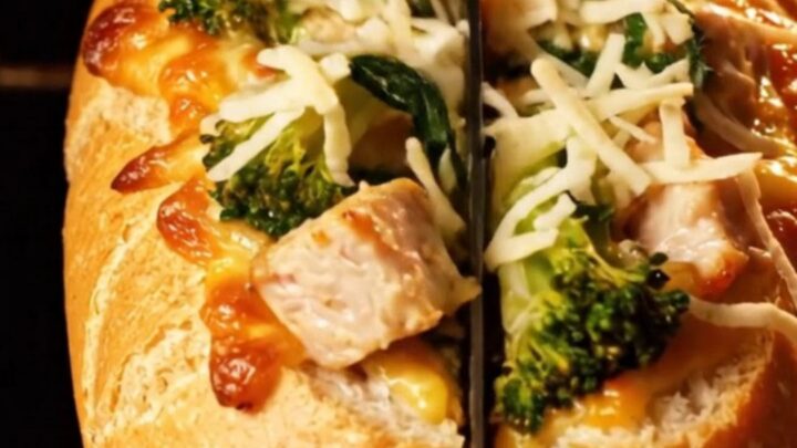 A golden-brown stuffed baguette filled with creamy chicken Alfredo and broccoli rabe.