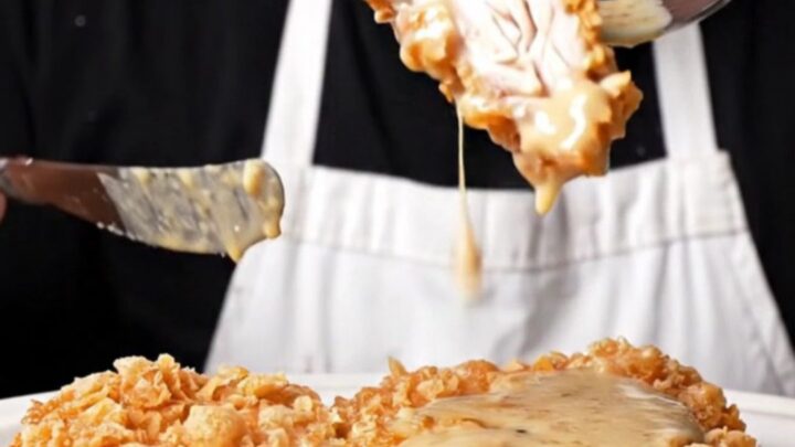A crispy saltine-crusted chicken fried steak covered in creamy cracked-pepper gravy.
