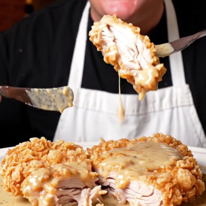 A crispy saltine-crusted chicken fried steak covered in creamy cracked-pepper gravy.