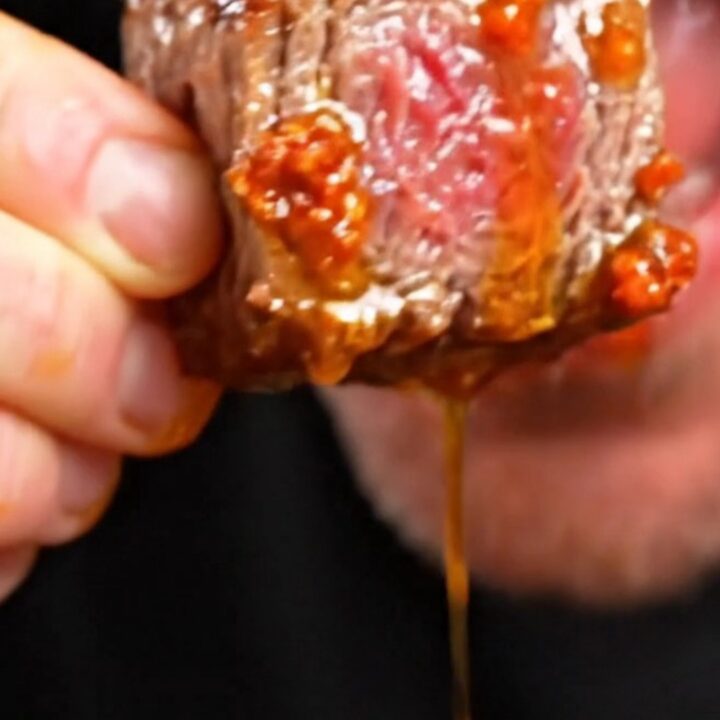 Juicy picanha steak bites with a crispy golden fat cap glistening with red chorizo butter.